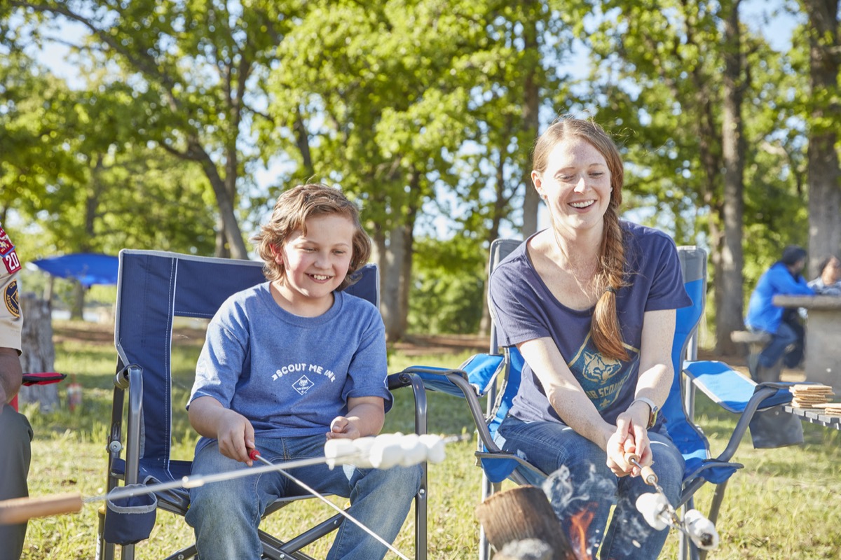 Cub Scouts and a leader at camp